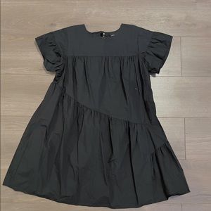 Mini and flowy mini dress in black. It is size small. From Who What Wear.